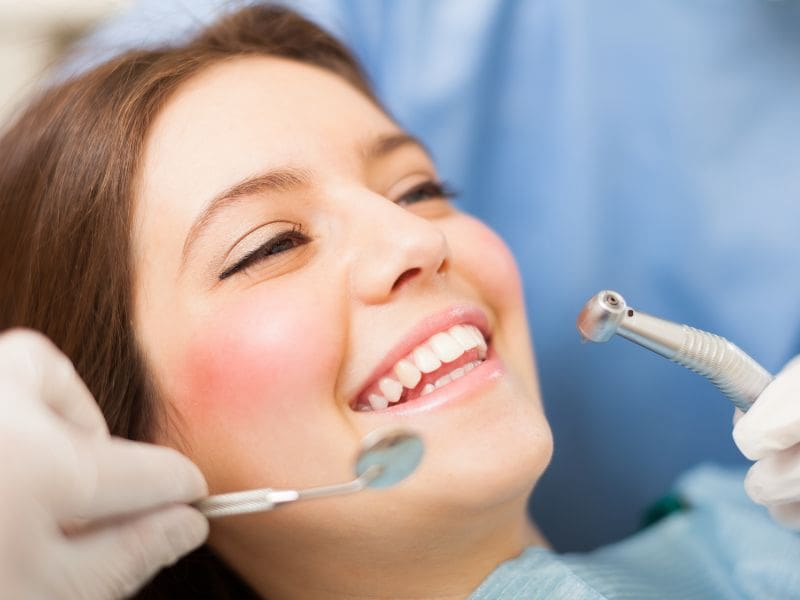 Woman smiling during dental examination